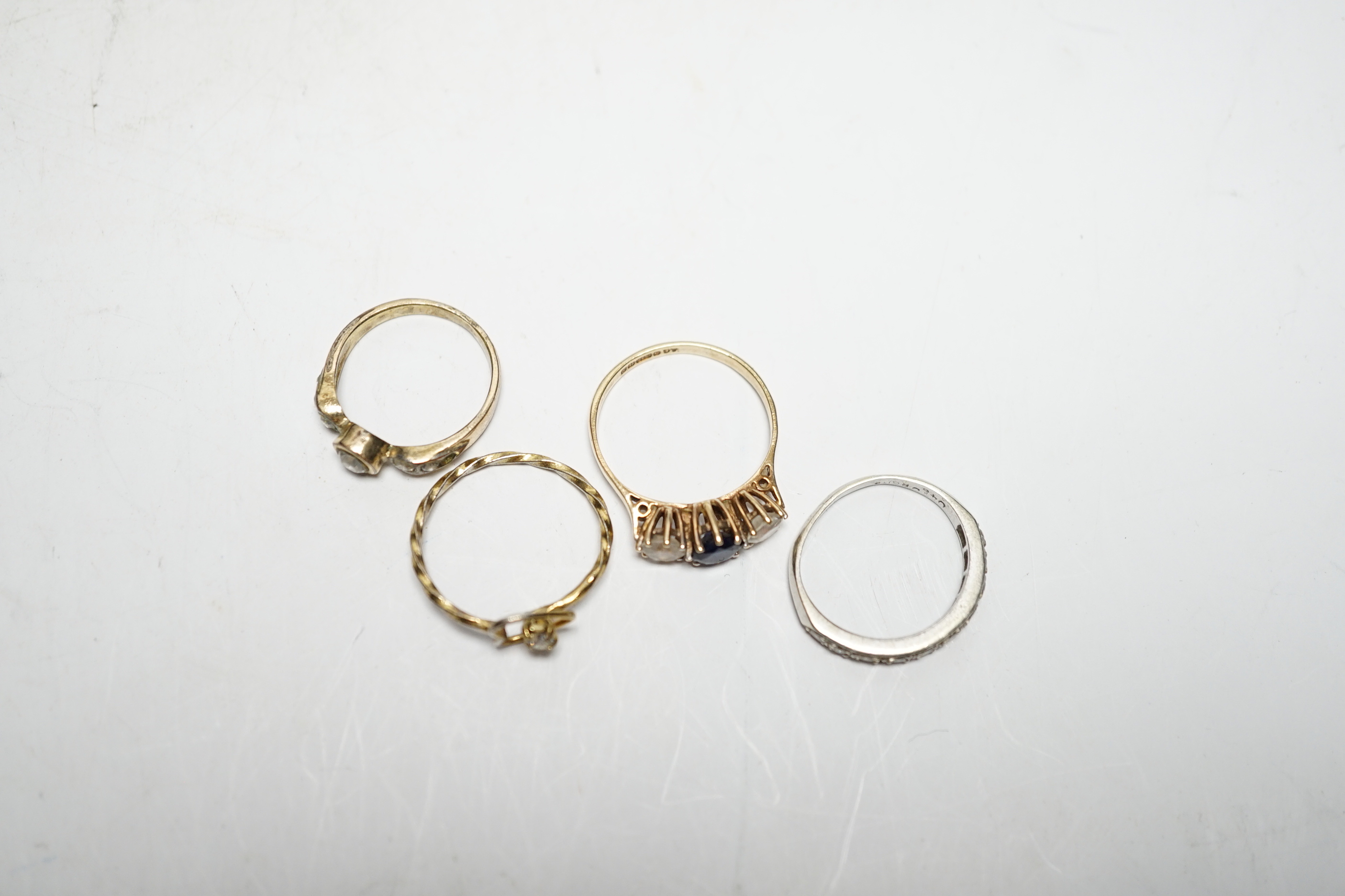 Two 9ct and gem set rings, including diamond chip half eternity and two other rings.